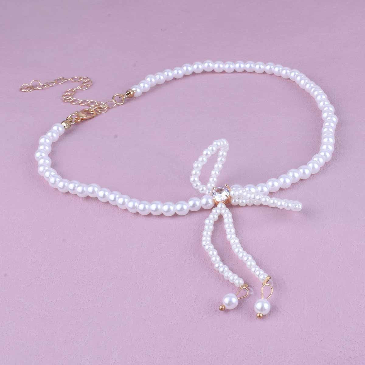 UNI-10509 -  Pearly Bow - Necklace